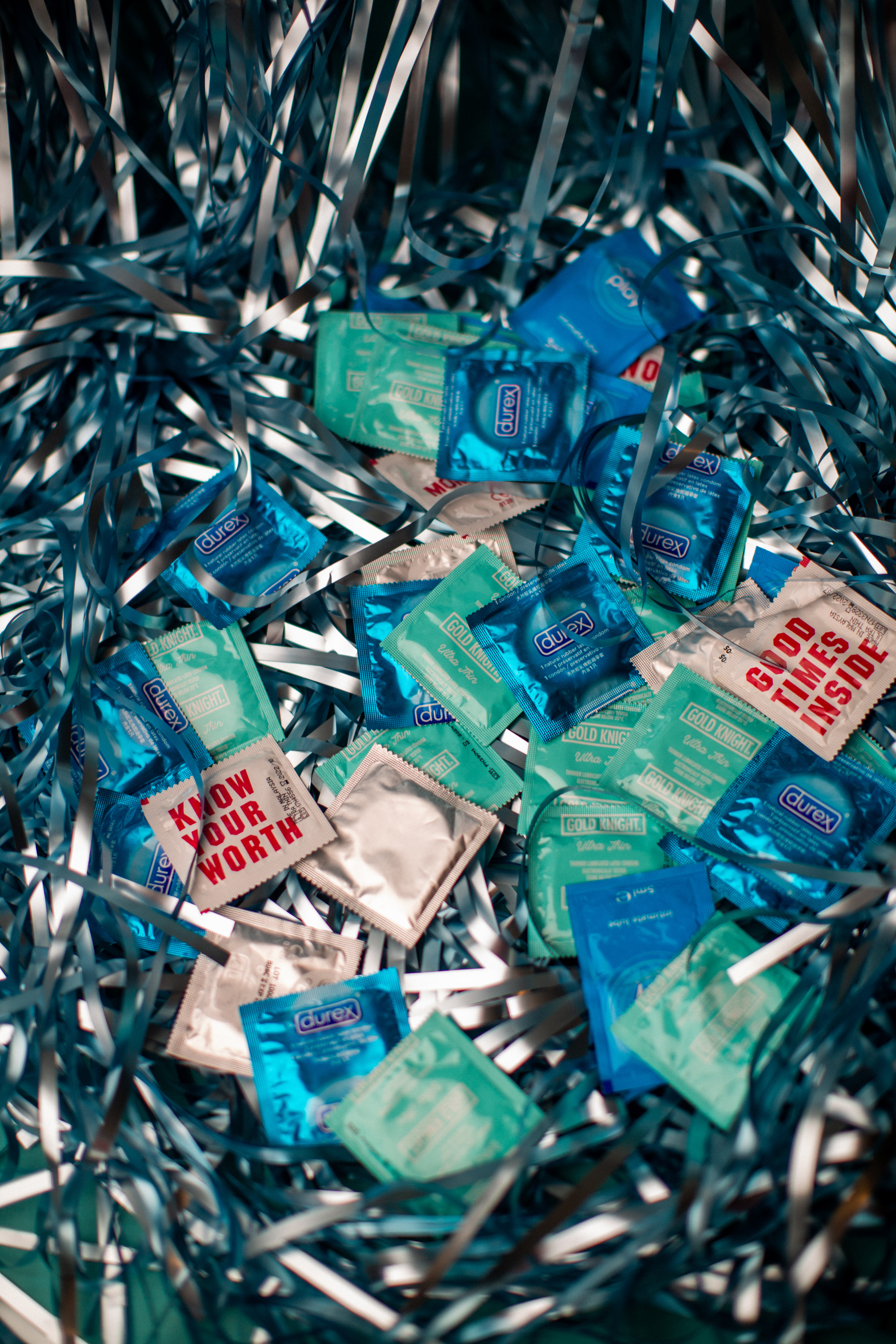Bunch of condoms surrounded by streamers