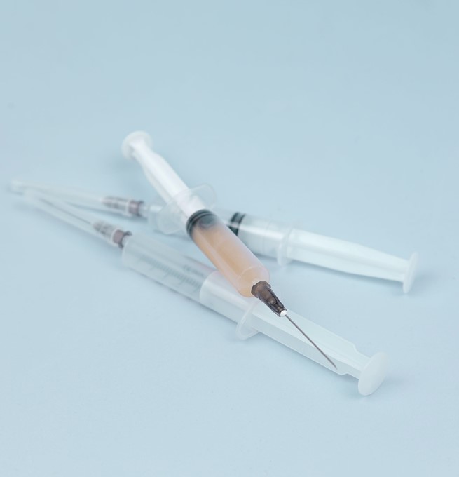 Three needles positioned on top of eachother