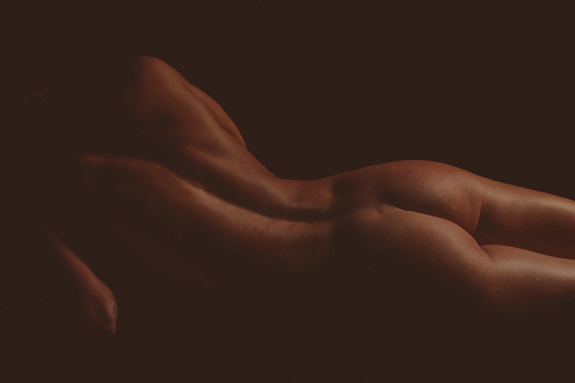 View of the back and butt of a naked person
