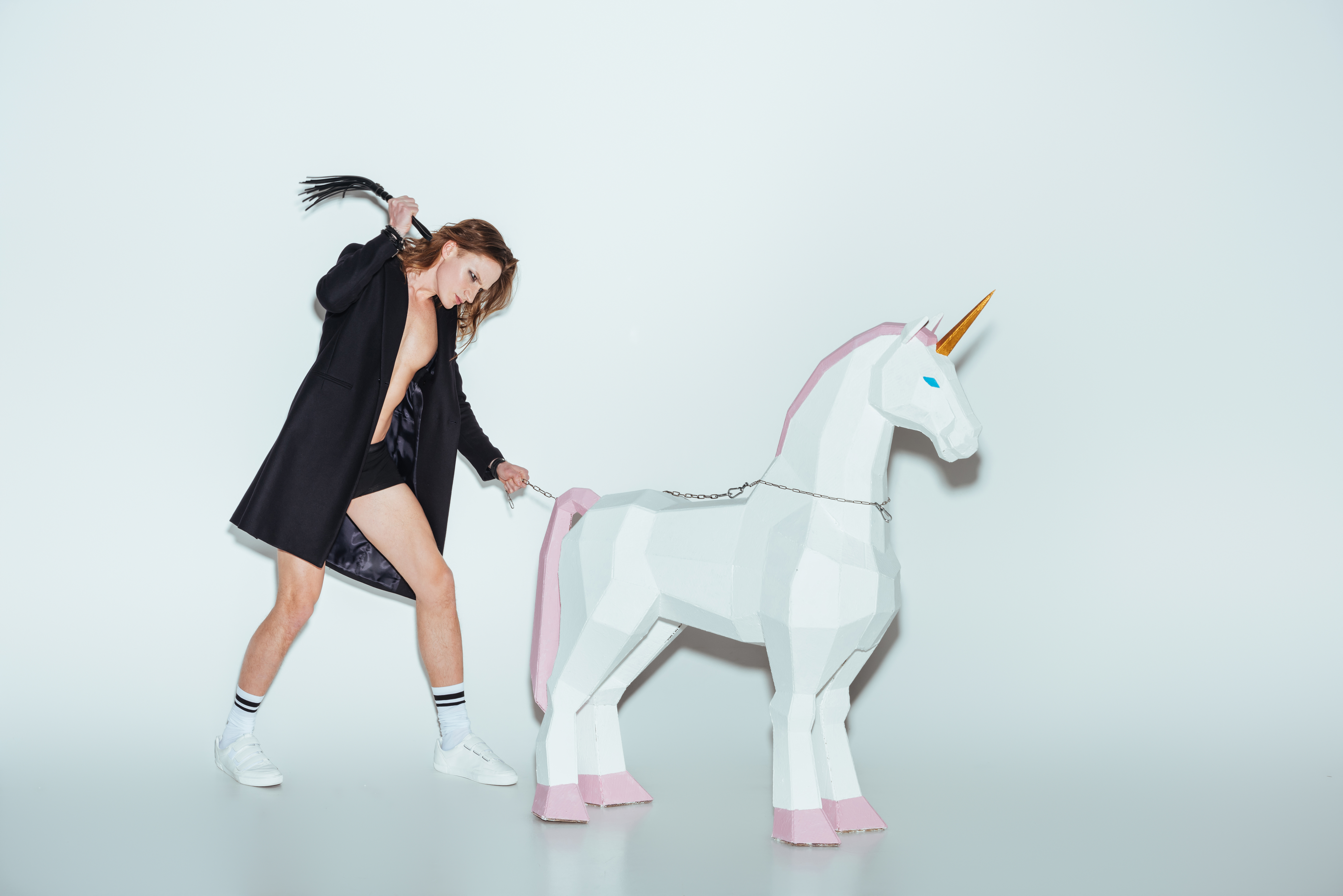 Person whipping a unicorn