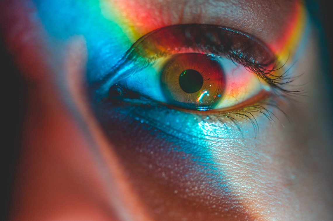 eye close up with a rainbow reflection