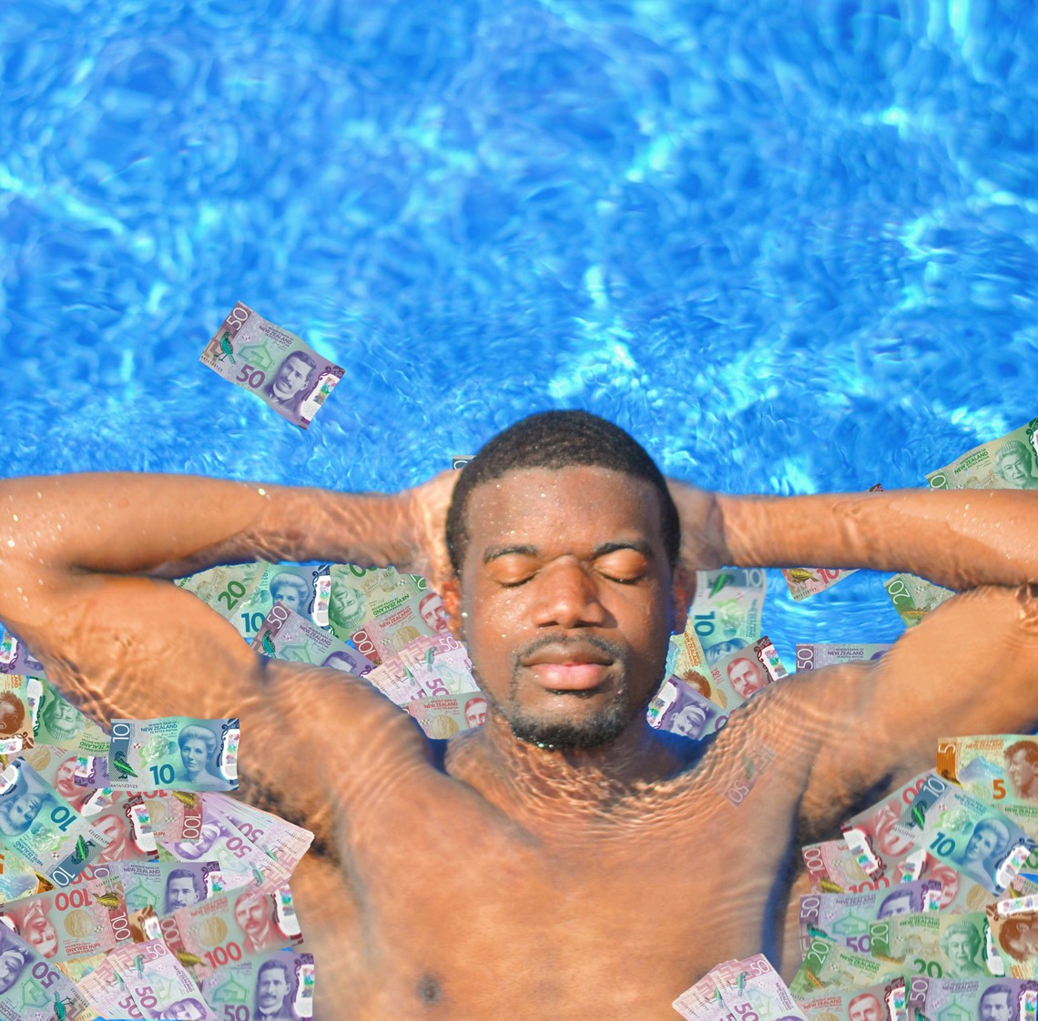 Person swimming in a pool of money